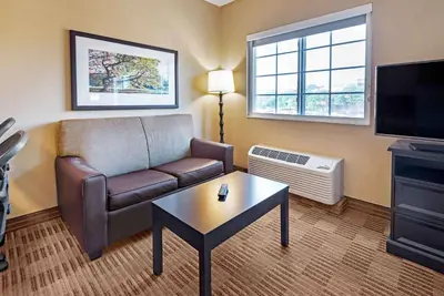 a living room with a couch and a coffee table at Extended Stay America Suites - Secaucus - New York City Area in Secaucus