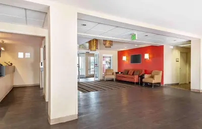 a lobby of a hospital with a couch and chairs at Extended Stay America Suites - Secaucus - New York City Area in Secaucus