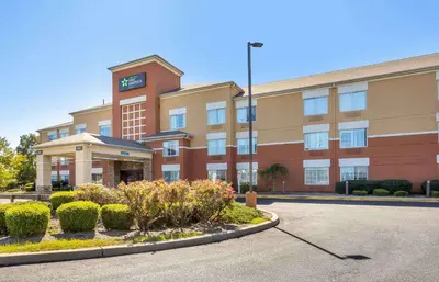 an office building with a clock on top of it at Extended Stay America Suites - Meadowlands - East Rutherford in East Rutherford