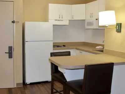 a kitchen with white appliances and a white refrigerator at Extended Stay America Suites - Meadowlands - East Rutherford in East Rutherford