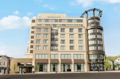 a large building with a curved tower at The MC, Autograph Collection in Montclair