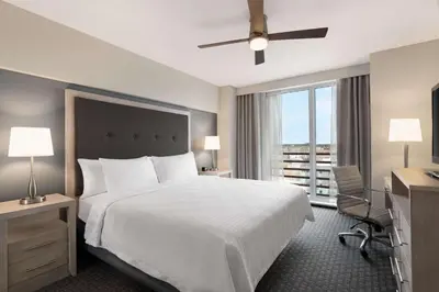 a hotel room with a large bed and a window at Homewood Suites University City Philadelphia in Philadelphia