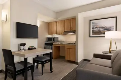 a living room with a couch and a table in a room at Homewood Suites University City Philadelphia in Philadelphia