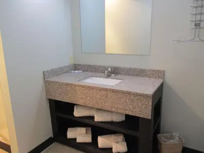 a bathroom with a sink and a mirror and towels at Motel 6-Shartlesville, PA in Shartlesville