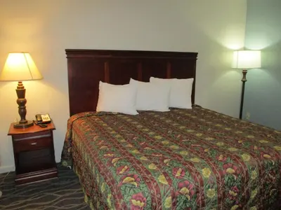 a hotel room with a bed and two lamps at Motel 6-Shartlesville, PA in Shartlesville