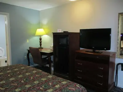 a hotel room with a bed and a flat screen tv at Motel 6-Shartlesville, PA in Shartlesville