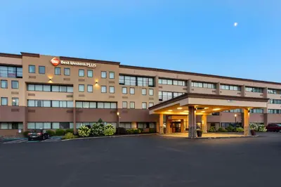 a hotel with a parking lot in front of it at Best Western Plus Reading Inn & Suites in Reading
