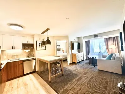 a kitchen and living room with a couch and a table at Staybridge Suites East Stroudsburg - Poconos by IHG in East Stroudsburg