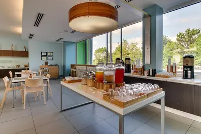 a kitchen with a table with glasses on it at Element Ewing Princeton in Ewing