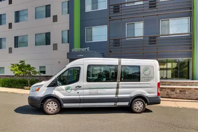 a white van parked in front of a building at Element Ewing Princeton in Ewing