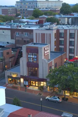 a building with a car parked in front of it at The Hotel Warner in West Chester
