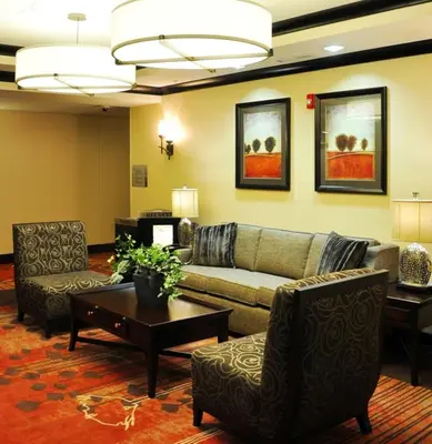 a living room with a couch and chairs and a table at Homewood Suites - Doylestown in Warrington