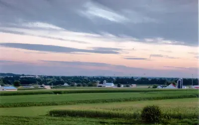 a view of a field with a cloudy sky at Harvest Drive Family Inn - Renovated Rooms in Gordonville