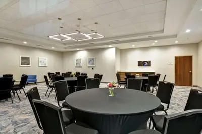 a conference room with a table and chairs at Hilton Garden Inn Princeton Lawrenceville in Lawrenceville