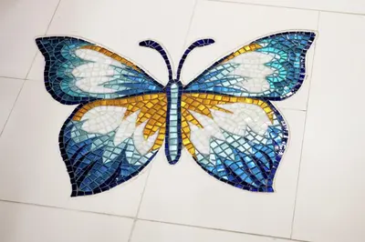 a mosaic butterfly on the wall of a bathroom at Staypineapple, An Artful Hotel, Midtown New York in New York
