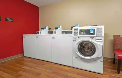 a washing machine and a washer and dryer in a room at Extended Stay America Suites - Princeton - South Brunswick in South Brunswick Terrace