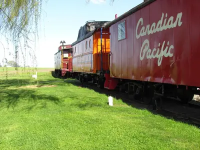 a red train on the tracks in a field at Red Caboose Motel & Restaurant in Ronks
