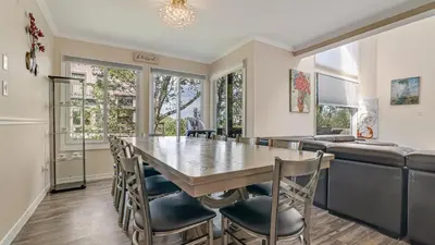 a kitchen and dining room with a table and chairs at The Best Views From Camelback in Tannersville