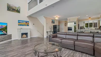 a living room with a couch and a fireplace at The Best Views From Camelback in Tannersville