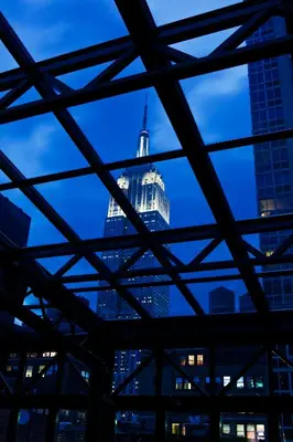 a view of the empire state building at night at Refinery Hotel - New York in New York