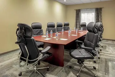 a conference room with a long table and chairs at Hampton Inn Cranbury in Cranbury