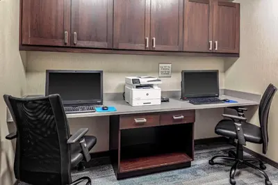 an office with two computers sitting on a desk at Hampton Inn Cranbury in Cranbury