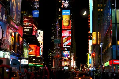 a busy city street at night with neon signs at Business & Family Friendly Balcony Jacuzzi Free Park in Jersey City