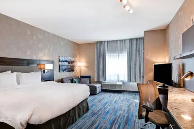a hotel room with a large bed and a television at TownePlace Suites by Marriott Bridgewater Branchburg in Branchburg Park
