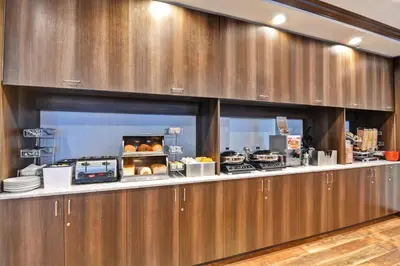 a kitchen with a counter with food on it at TownePlace Suites by Marriott Bridgewater Branchburg in Branchburg Park