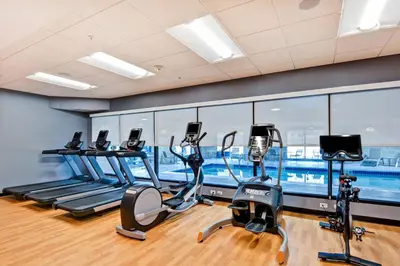 a gym with treadmills and elliptical machines at TownePlace Suites by Marriott Bridgewater Branchburg in Branchburg Park