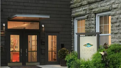 a sign in front of a house with aletcher hotel at Ledges Hotel in Hawley