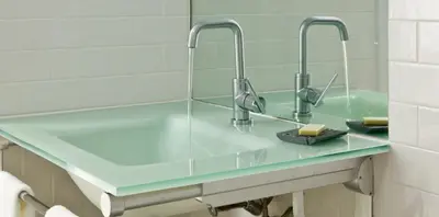 a bathroom with two faucets and a sink at Ledges Hotel in Hawley