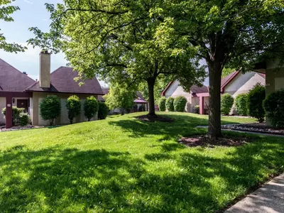 two trees in the yard of a house at Inn of The Dove Romantic Luxury & Business Suites in Bensalem