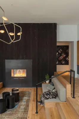 a living room with a fireplace and a couch at ROOST East Market in Philadelphia