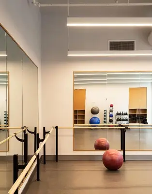 a bowling alley with balls on the floor in a room at ROOST East Market in Philadelphia