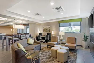 a lobby with a waiting room and a dining room at Best Western Plus Philadelphia-Pennsauken Hotel in Cherry Hill