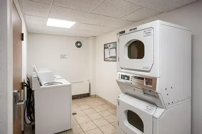 a room with a medical examination room with a microwave at Motel 6-Binghamton, NY in Binghamton