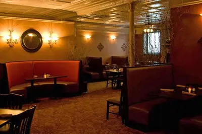 a restaurant with couches and tables in a room at The Inn at Jim Thorpe in Jim Thorpe