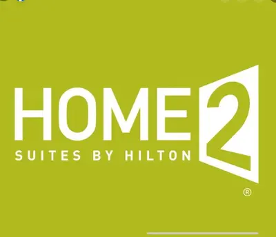 a sign that reads home suites by hilton at Home2 Suites By Hilton Newark Airport in Newark