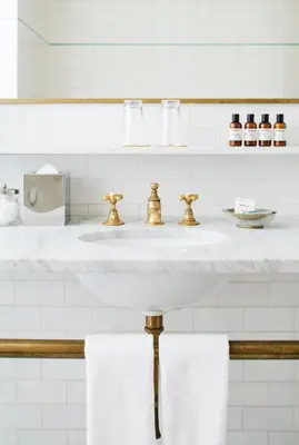 a bathroom with a white sink with two towels at The Bowery Hotel in New York