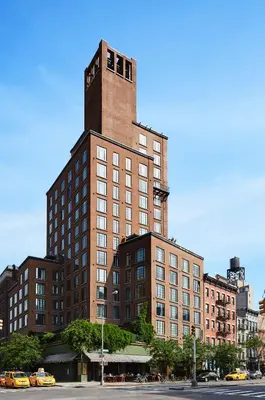 a tall brick building with a tower on top of it at The Bowery Hotel in New York