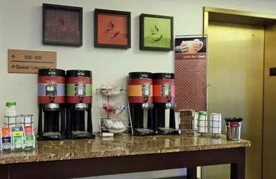 a group of coffee machines on a counter at Hampton Inn Philadelphia-Great Valley in Frazer
