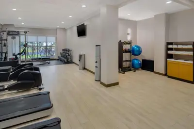 a gym with treadmills and exercise equipment in a room at DoubleTree Suites by Hilton Mount Laurel in Mount Laurel
