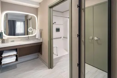 a bathroom with a sink and a mirror at DoubleTree Suites by Hilton Mount Laurel in Mount Laurel
