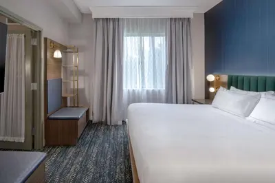 a hotel room with a large bed and a window at DoubleTree Suites by Hilton Mount Laurel in Mount Laurel