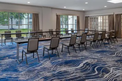 a conference room with a long table and chairs at DoubleTree Suites by Hilton Mount Laurel in Mount Laurel