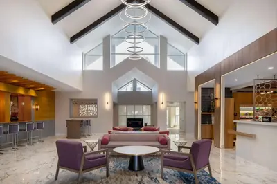 a living room with a couch and chairs and a table at DoubleTree Suites by Hilton Mount Laurel in Mount Laurel