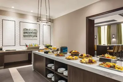 a buffet line with many plates of food on it at Homewood Suites by Hilton Philadelphia-City Avenue in Philadelphia