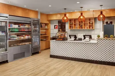 a grocery store with a counter in a store at DoubleTree by Hilton Hotel Philadelphia Center City in Philadelphia