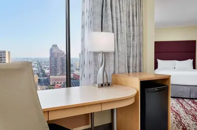 a hotel room with a desk with a bed and a window at DoubleTree by Hilton Hotel Philadelphia Center City in Philadelphia